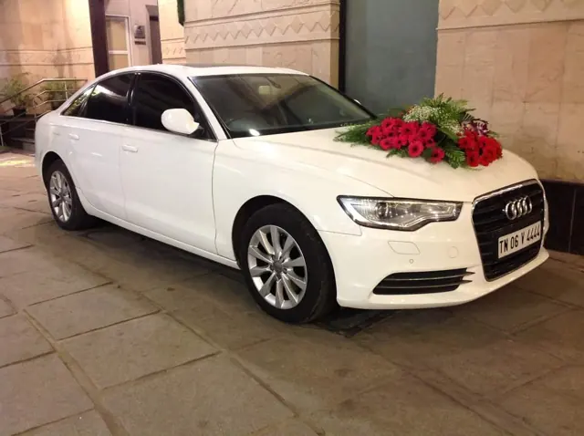 White Audi bridal car with red roses in Chennai