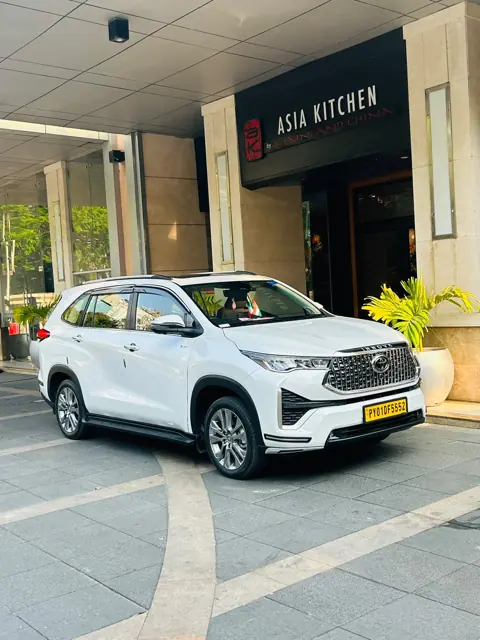 White Innova Hycross at a Chennai hotel entrance for a chauffeur pickup
